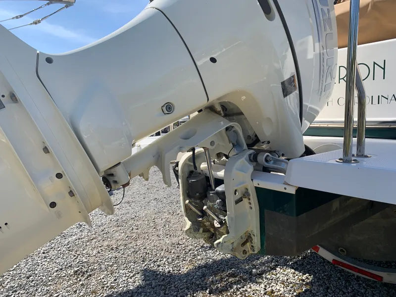 Slide: The Image of 2018 Ranger Tugs R-23 outboard motor on gravel surface. - 43