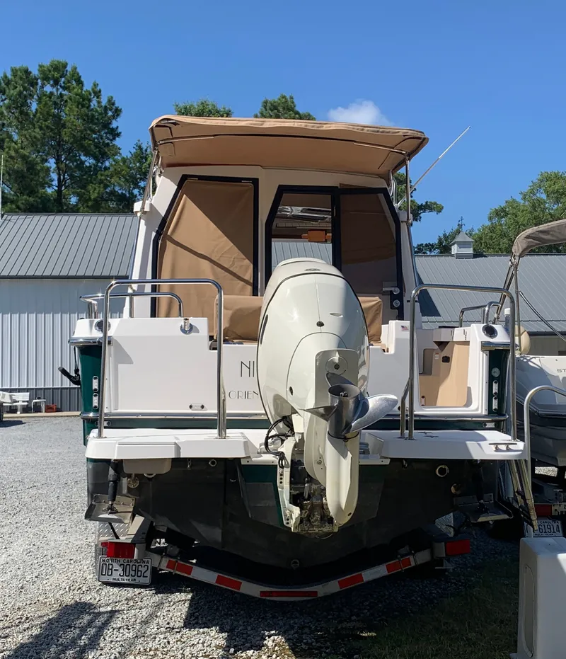 Slide: The Image of 2018 Ranger Tugs R-23 boat with outboard motor, rear view. - 5