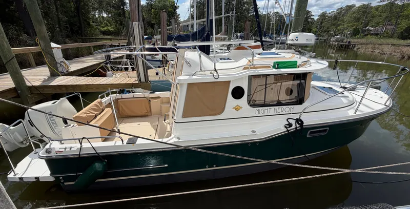 Slide: The Image of 2018 Ranger Tugs R-23 boat docked at marina. - 7