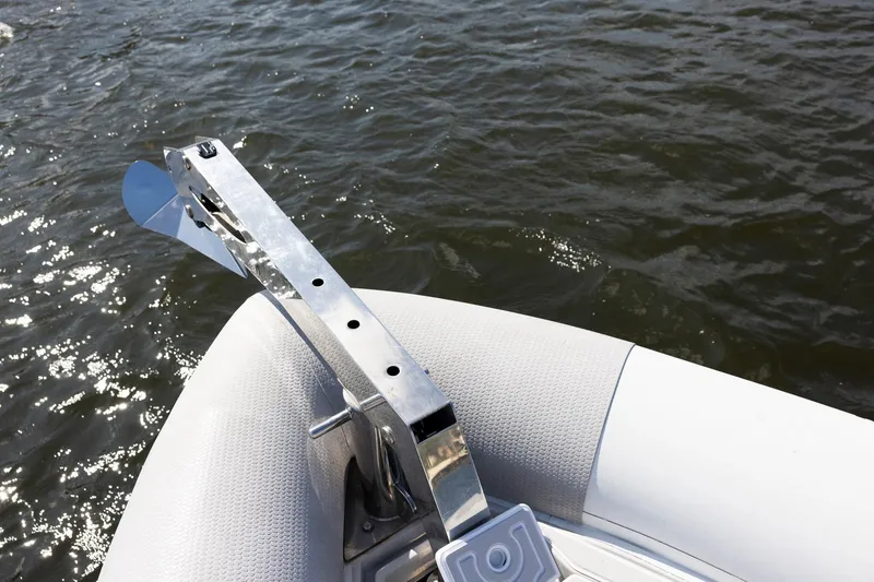 Slide: The Image of Bow of Zeta Elle 34 Custom boat with anchor, 2013 model, on water. - 14