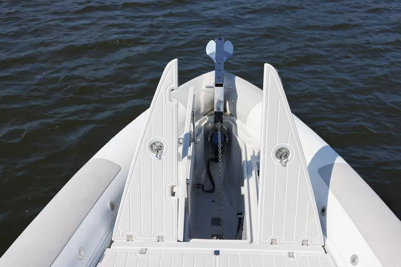 Slide: The Image of Bow of 2013 Zeta Elle 34 Custom boat with anchor and chain on water. - 16