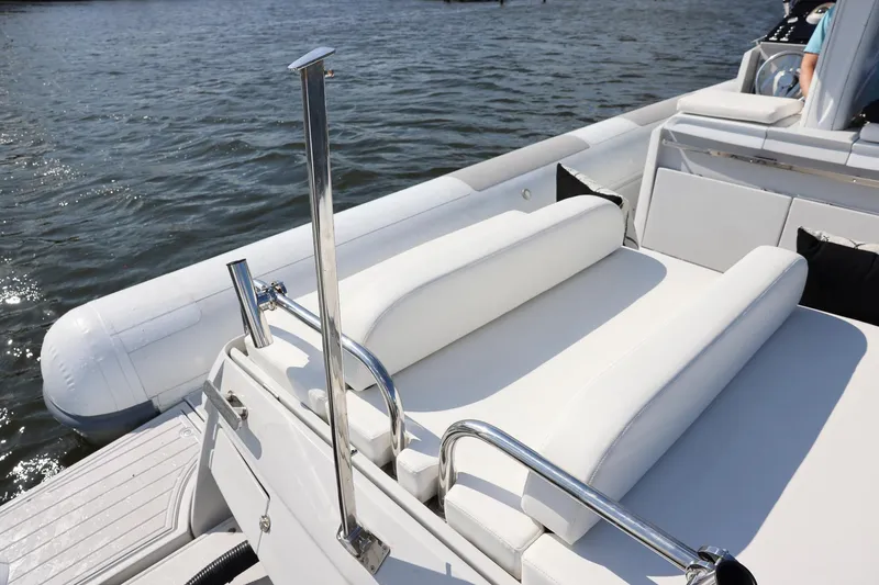 Slide: The Image of Luxury Zeta Elle 34 Custom yacht interior, 2013 model, with white seating on water. - 18
