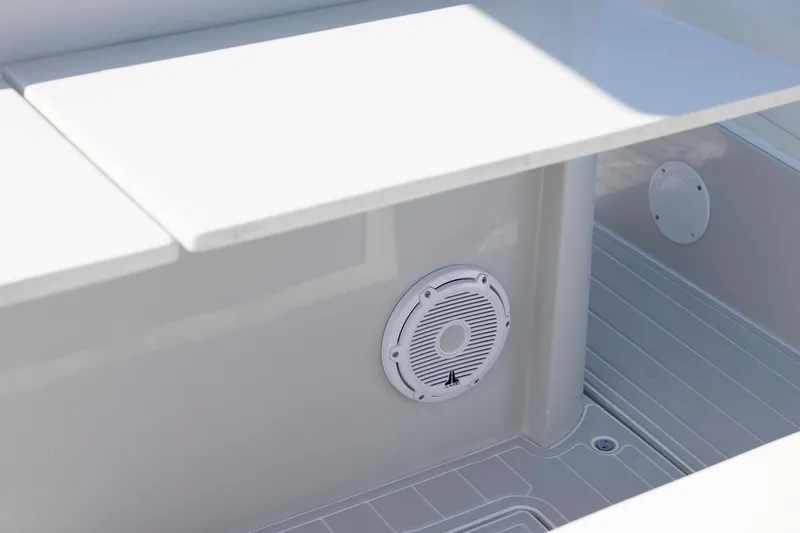 Slide: The Image of White interior of 2013 Zeta Elle 34 Custom boat with speaker detail. - 27