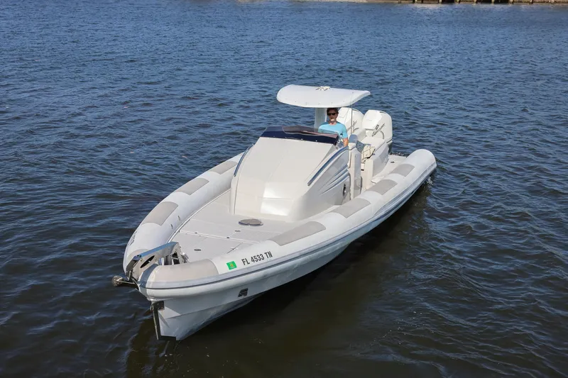Slide: The Image of 2013 Zeta Elle 34 Custom boat cruising on open water. - 5