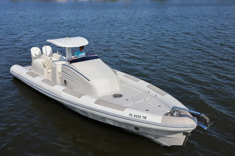 Slide: The Image of 2013 Zeta Elle 34 Custom boat cruising on calm waters. - 11