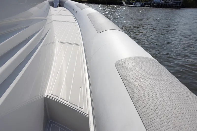 Slide: The Image of 2013 Zeta Elle 34 Custom boat deck, sleek design by the water. - 19