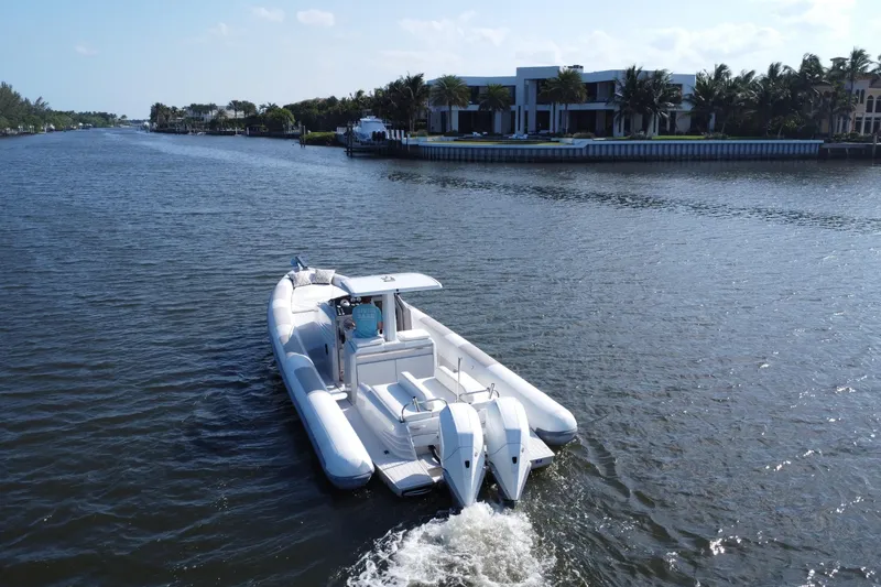 Slide: The Image of Aerial view of 2013 Zeta Elle 34 Custom boat cruising on a scenic waterway. - 3