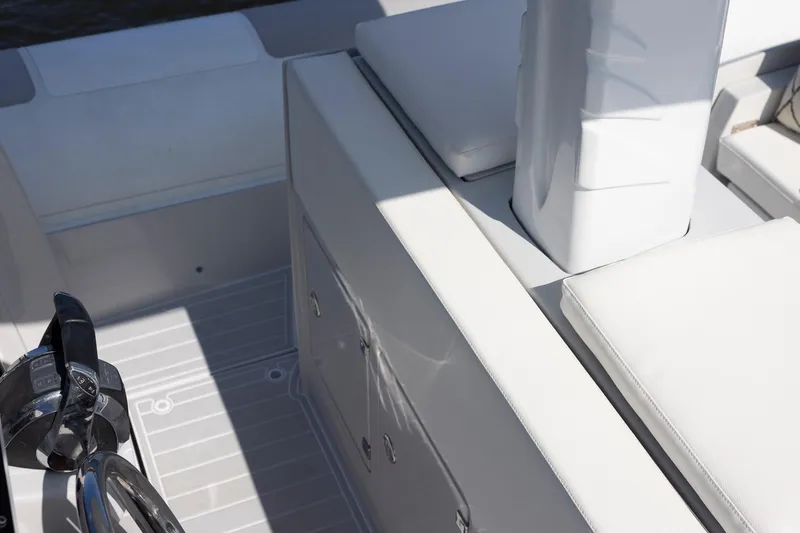 Slide: The Image of Interior of 2013 Zeta Elle 34 Custom boat with white seating and controls. - 31