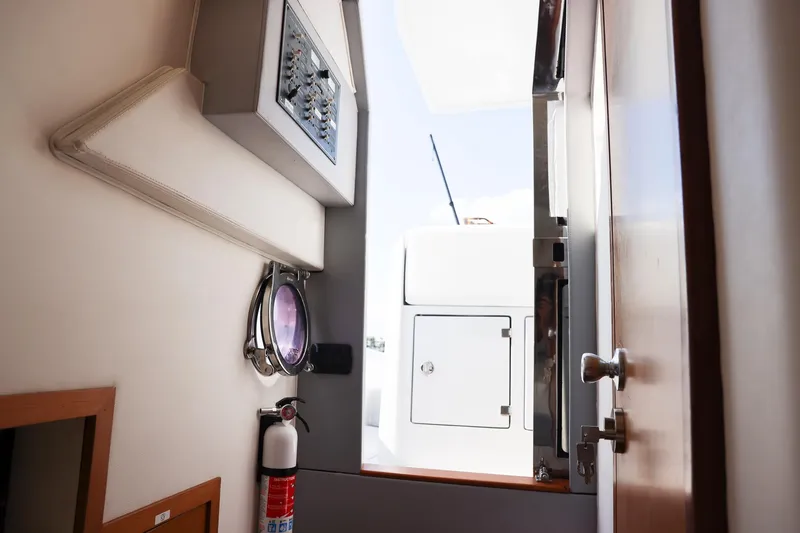 Slide: The Image of Interior view of 2013 Zeta Elle 34 Custom yacht with control panel and fire extinguisher. - 38