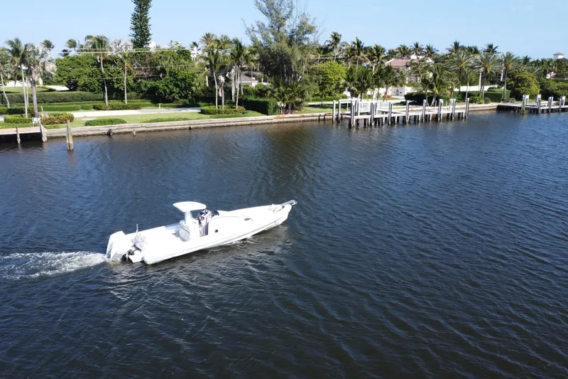 Slide: The Image of Aerial view of a 2013 Zeta Elle 34 Custom boat cruising on a scenic waterway. - 7