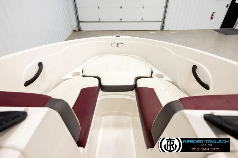 Slide: The Image of Interior view of a 2016 Tahoe 450 TS boat with maroon and white seating. - 15
