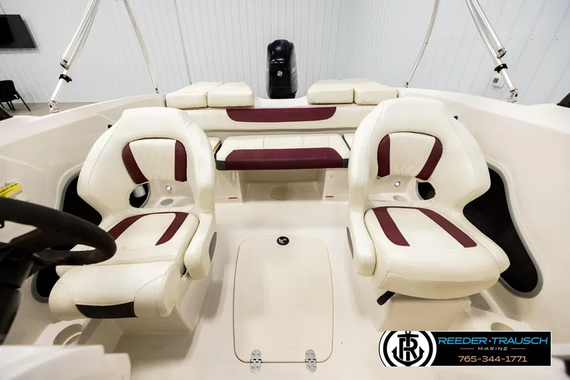 Slide: The Image of Interior of a 2016 Tahoe 450 TS boat with white and maroon seating. - 17