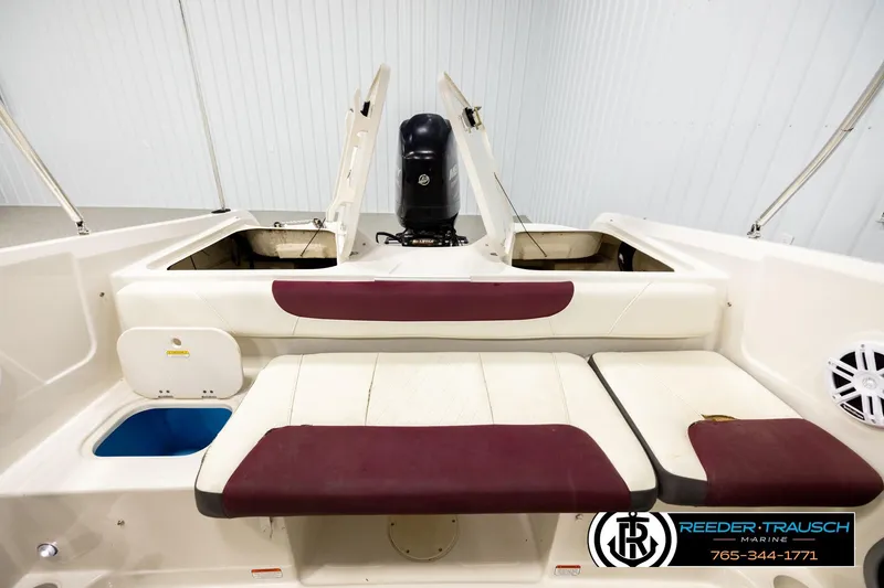 Slide: The Image of 2016 Tahoe 450 TS boat interior with seating and storage compartments. - 19