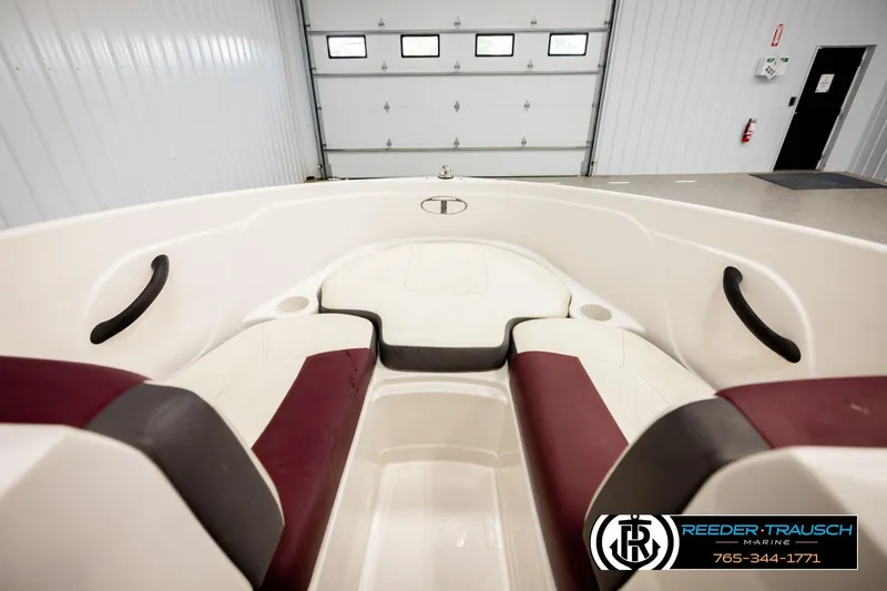 Slide: The Image of Interior view of a 2016 Tahoe 450 TS boat with maroon and white seating. - 21