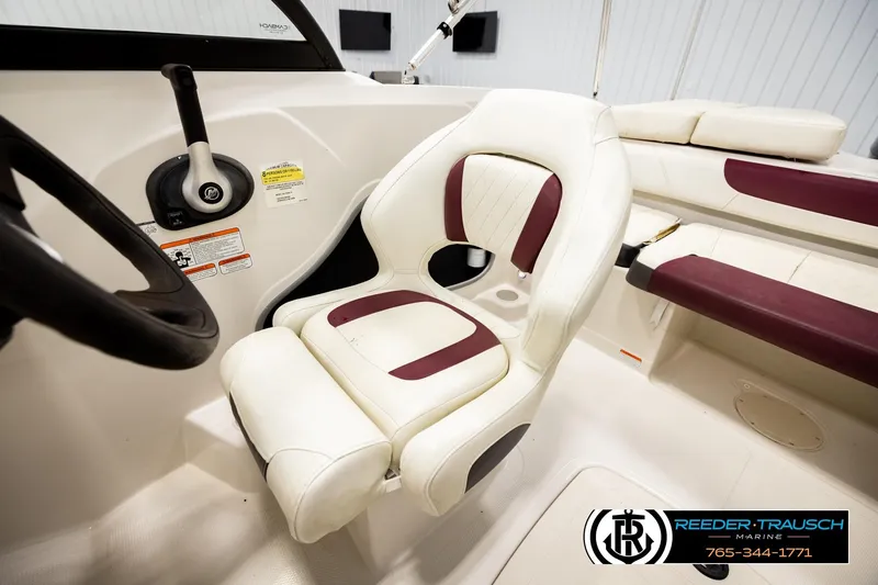 Slide: The Image of Interior of a 2016 Tahoe 450 TS boat with white and maroon seating. - 22