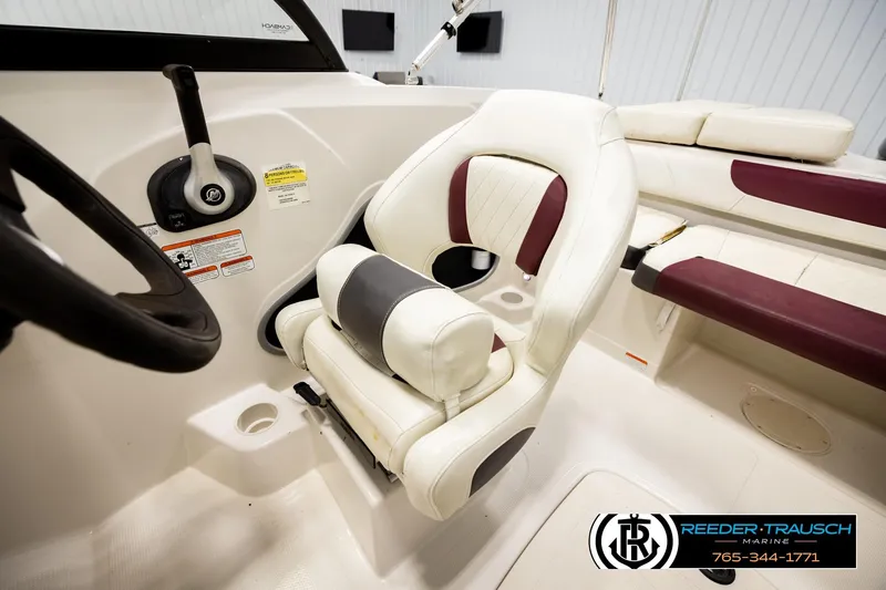 Slide: The Image of Interior of a 2016 Tahoe 450 TS boat with white and maroon seating. - 23