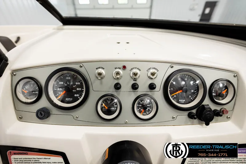 Slide: The Image of Dashboard of a 2016 Tahoe 450 TS boat with gauges and controls. - 29