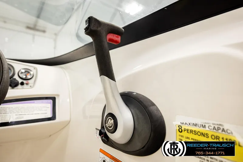 Slide: The Image of Close-up of 2016 Tahoe 450 TS boat throttle control in cockpit. - 30