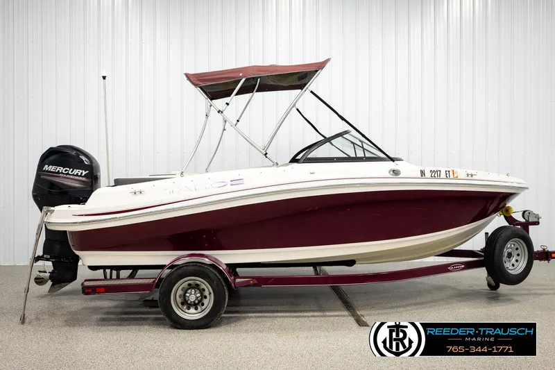 Slide: The Image of 2016 Tahoe 450 TS boat with Mercury engine on trailer in showroom. - 5