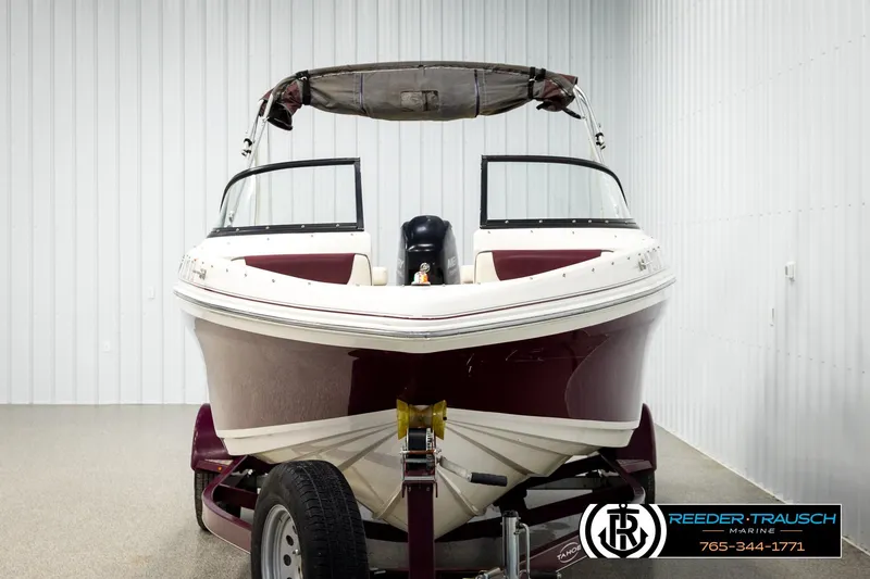 Slide: The Image of 2016 Tahoe 450 TS boat on trailer in indoor storage facility. - 8