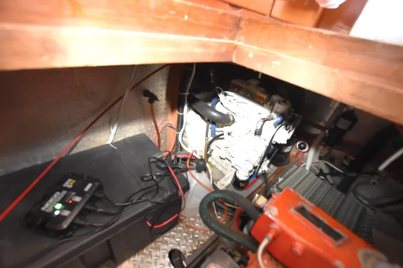 Slide: The Image of Engine room of 1988 Marine Trader 34 Double Cabin with visible wiring and components. - 18