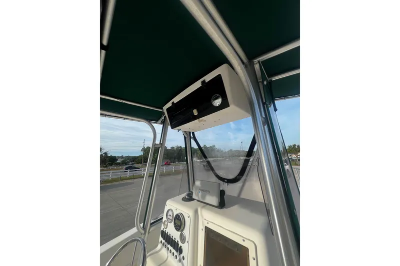 Slide: The Image of Sea Pro 200 Family Fish boat console with canopy and navigation equipment. - 10