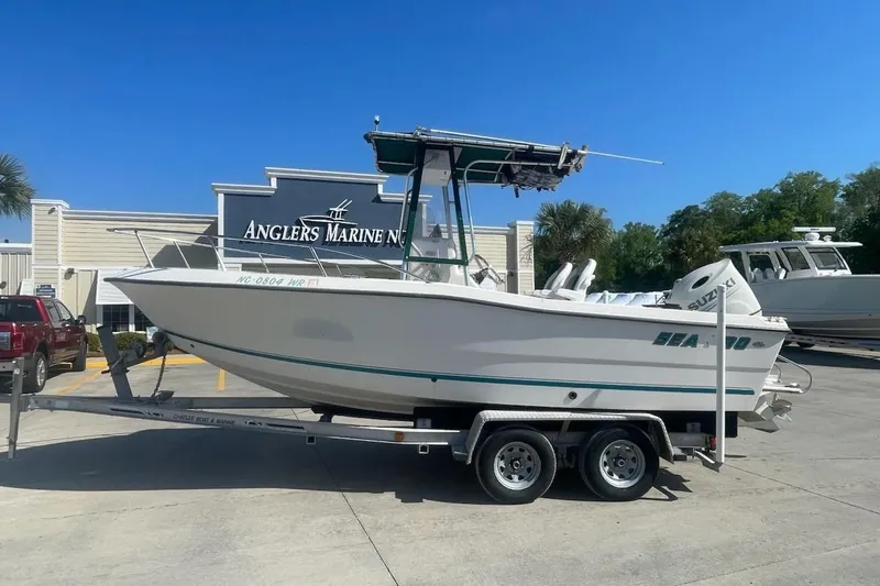 Slide: The Image of Sea Pro 200 Family Fish boat on trailer at Anglers Marine dealership. - 3