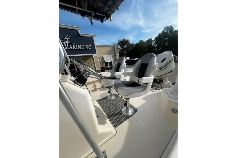 Slide: The Image of Sea Pro 200 Family Fish boat with Suzuki engine and dual seating at Marine NC. - 8