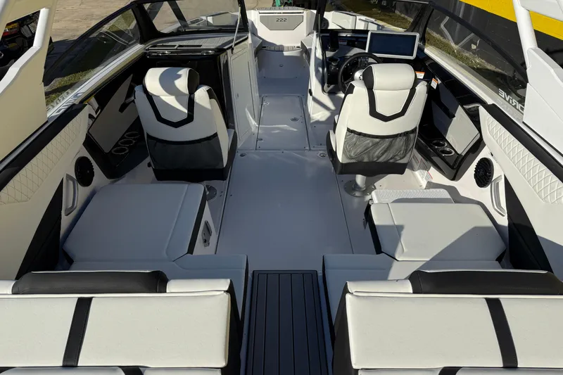 Slide: The Image of Interior of 2026 Yamaha Boats 222SD, featuring sleek seating and modern dashboard design. - 11