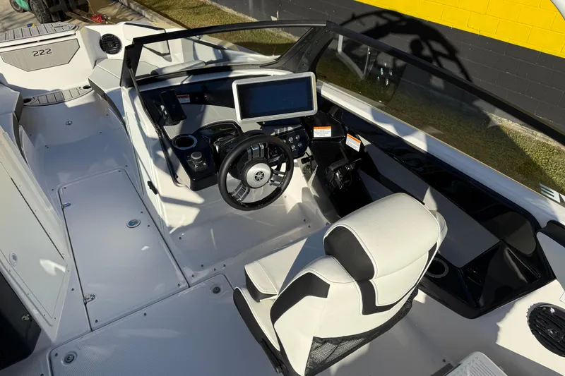 Slide: The Image of 2026 Yamaha Boats 222SD cockpit with modern steering and navigation system. - 13