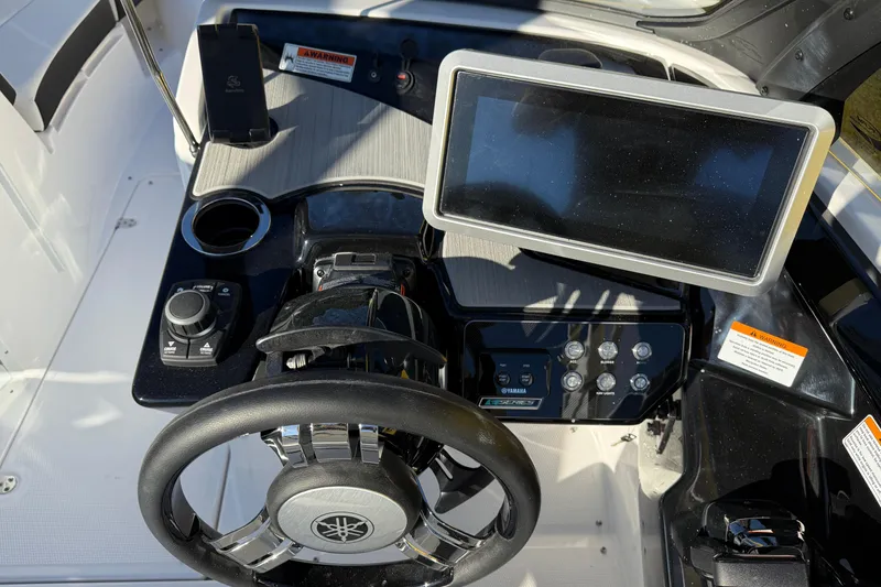 Slide: The Image of 2026 Yamaha Boats 222SD dashboard with steering wheel and touchscreen display. - 15