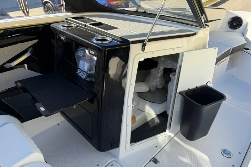 Slide: The Image of 2026 Yamaha Boats 222SD interior with storage and seating area. - 19