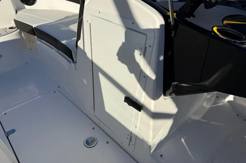 Slide: The Image of 2026 Yamaha Boats 222SD interior, featuring seating and storage compartment. - 23