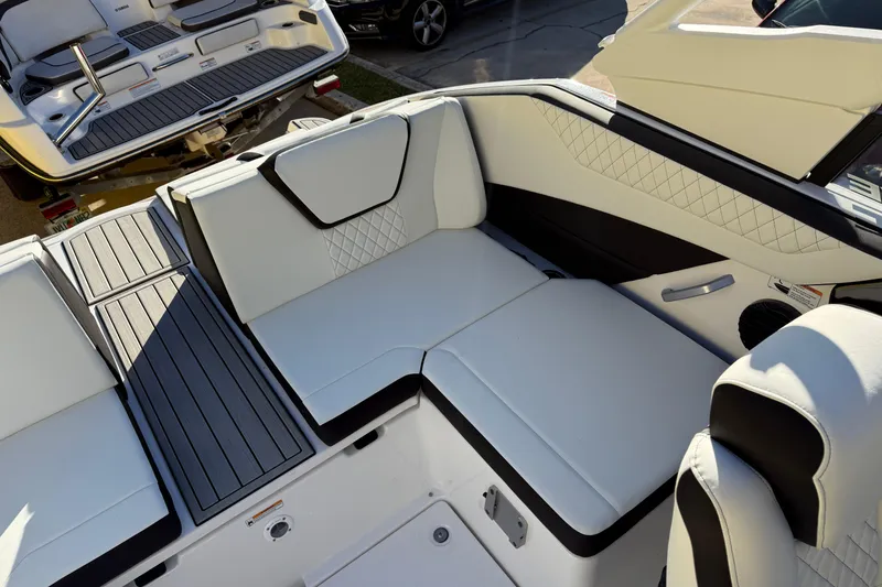 Slide: The Image of 2026 Yamaha Boats 222SD interior with luxurious white seating and sleek design. - 31