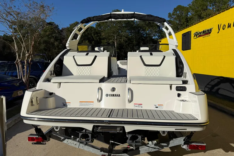 Slide: The Image of 2026 Yamaha Boats 222SD rear view, showcasing sleek design and spacious seating. - 9