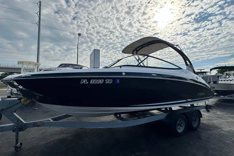 The Image of 2017 Yamaha Boats 242 Limited S on trailer under cloudy sky. - 0