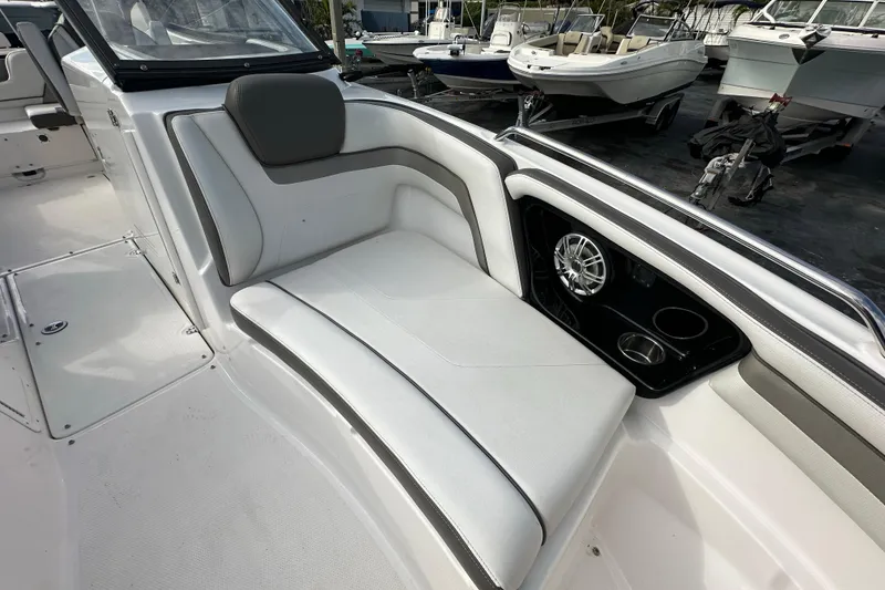 Slide: The Image of 2017 Yamaha Boats 242 Limited S interior with cushioned seating and speaker system. - 10