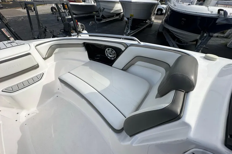 Slide: The Image of Interior of 2017 Yamaha Boats 242 Limited S, featuring white and gray seating. - 12