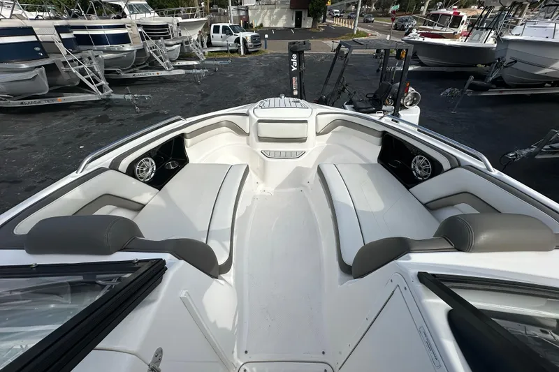 Slide: The Image of 2017 Yamaha Boats 242 Limited S interior with spacious seating and sleek design. - 13