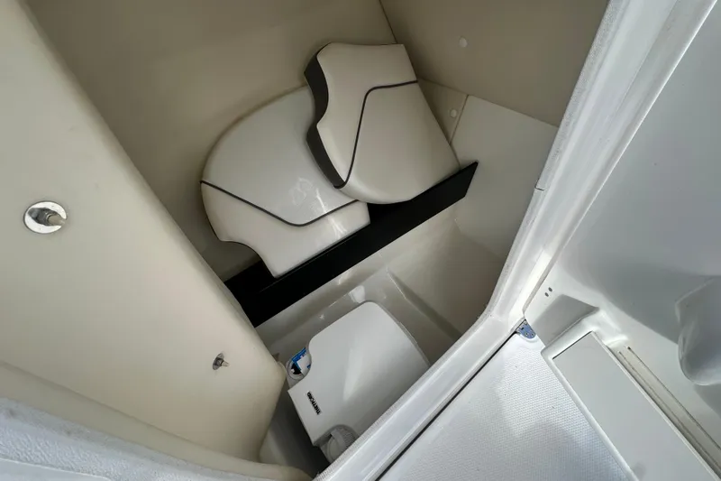Slide: The Image of Interior of 2017 Yamaha Boats 242 Limited S, featuring compact seating and storage. - 15