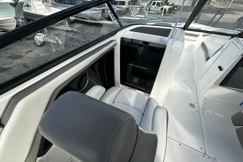 Slide: The Image of 2017 Yamaha Boats 242 Limited S interior with seating and dashboard view. - 17