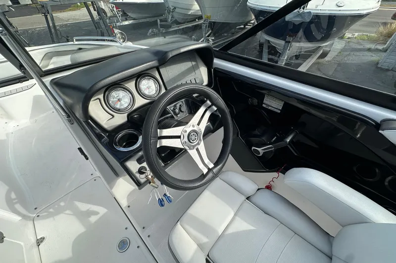 Slide: The Image of 2017 Yamaha Boats 242 Limited S dashboard with steering wheel and gauges. - 19