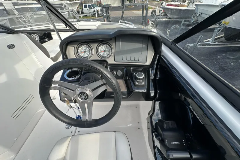 Slide: The Image of 2017 Yamaha Boats 242 Limited S dashboard with steering wheel and control panel. - 20