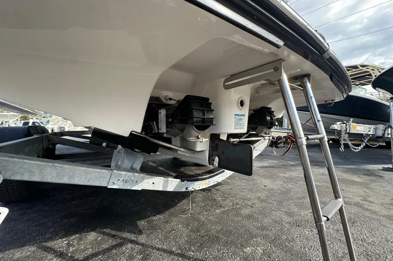 Slide: The Image of 2017 Yamaha Boats 242 Limited S on trailer, showing rear view with ladder. - 4