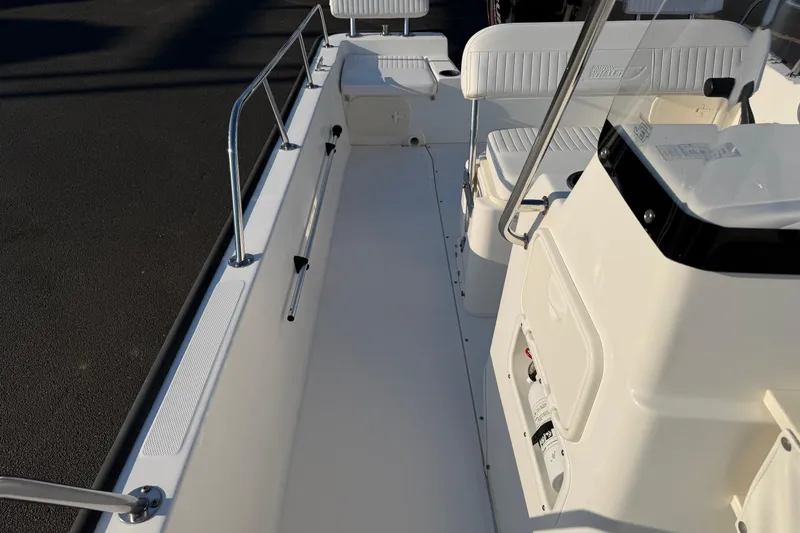 Slide: The Image of 2014 Boston Whaler 190 Montauk boat interior with seating and console. - 10