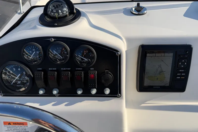 Slide: The Image of Dashboard of a 2014 Boston Whaler 190 Montauk with gauges and GPS system. - 16