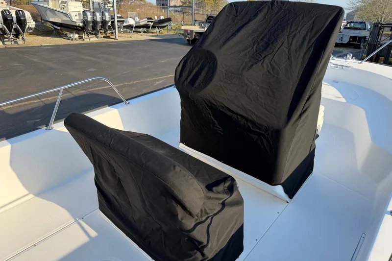 Slide: The Image of 2014 Boston Whaler 190 Montauk boat with covered seats and console. - 18