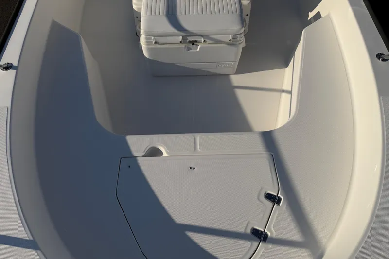 Slide: The Image of 2014 Boston Whaler 190 Montauk boat interior with seating and storage. - 7