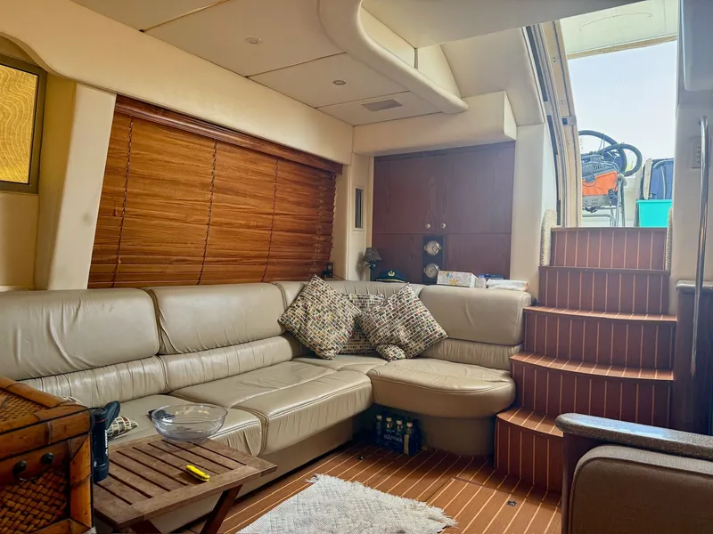 Slide: The Image of Interior of a 1999 Maxum 4100 SCA yacht with leather sofa. - 17