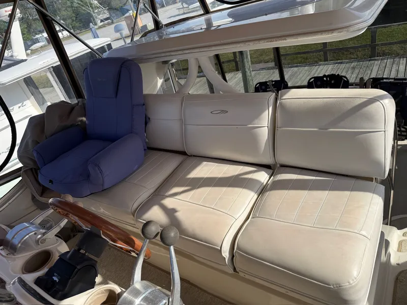 Slide: The Image of Interior of a 1999 Maxum 4100 SCA with beige seating area. - 21